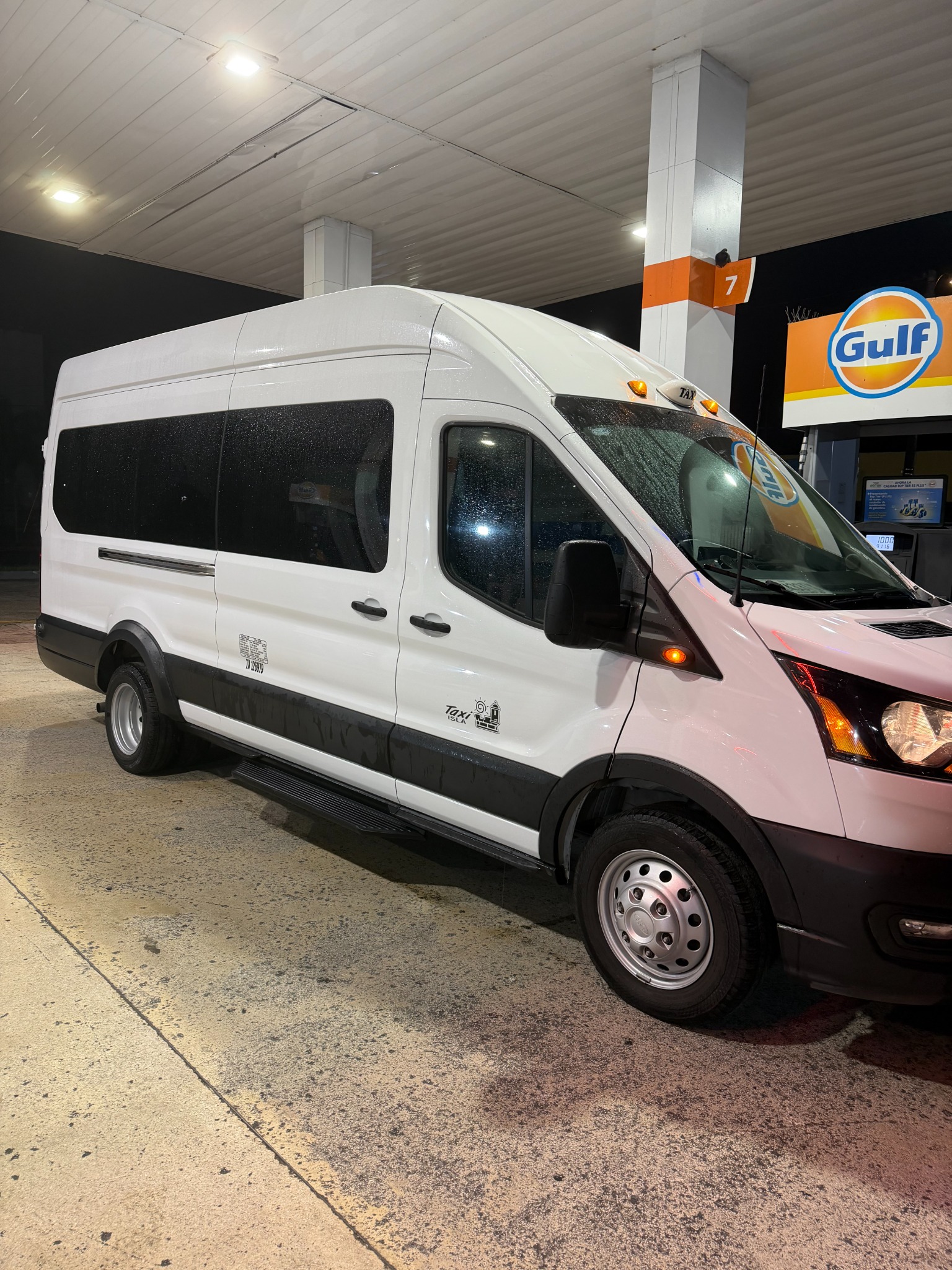 Our white high-roof Ford Transit 350 HD passenger van